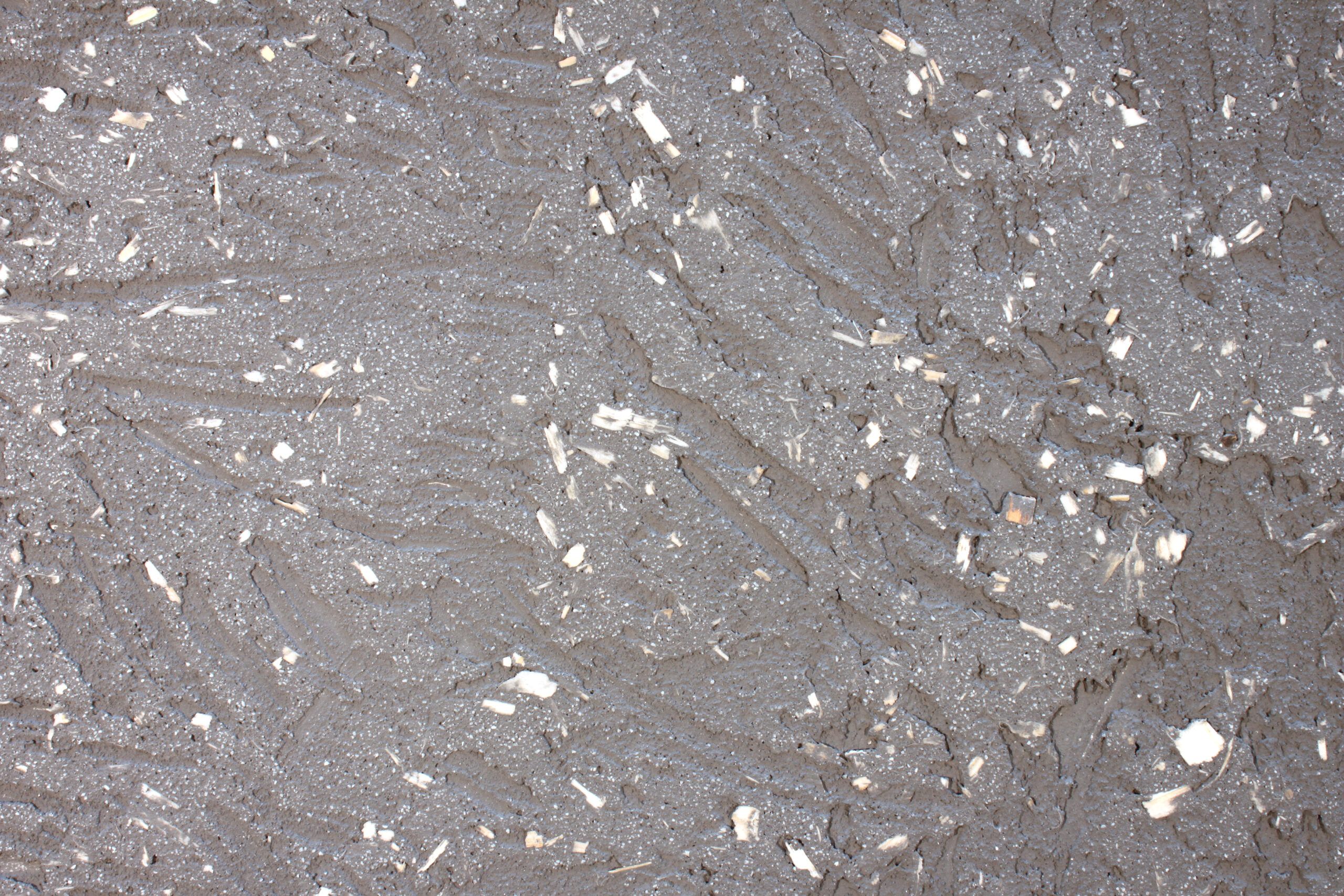 Ein Ausschnitt einer grau verputzten Lehmwand  - Malermeister Marco Schubert | Wolfenbüttel